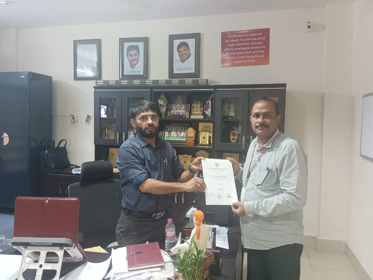 Previous Research Centre Recognition – Cycle 1 (2023–24 & 2024–25) - Dr. Gandi Satyanarayana receiving allotment letter from Dr. Swami Naidu Gurugubelli
